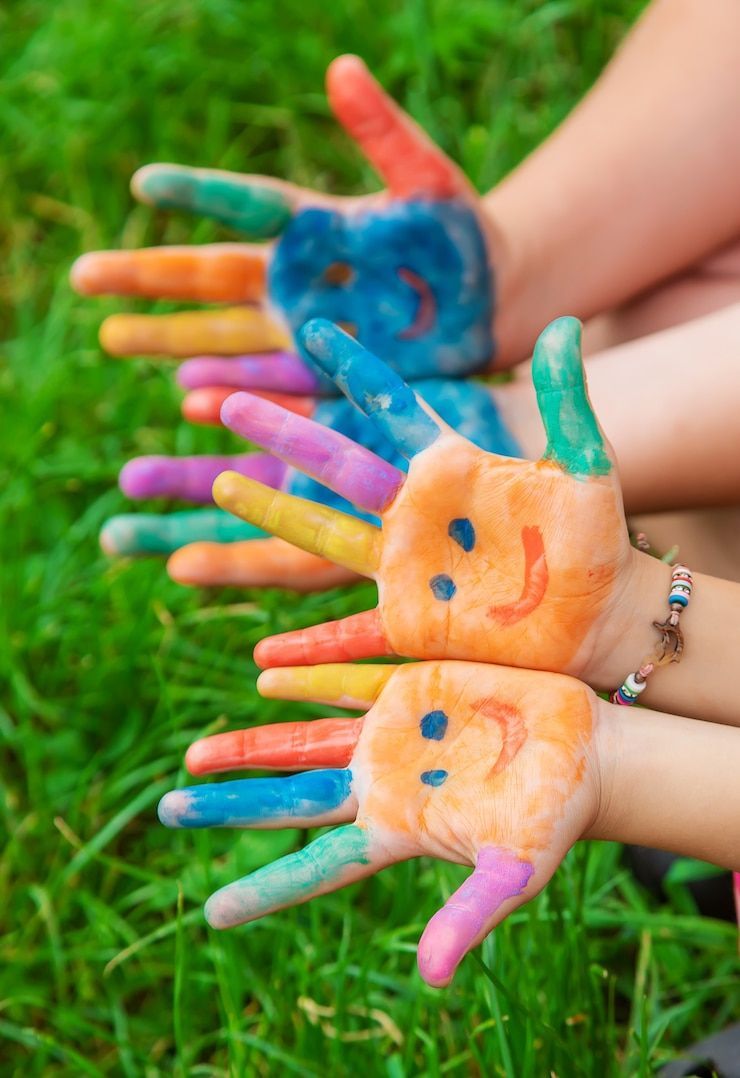 Colorful paint-covered hands from a Little Atlas Kids campaign shoot