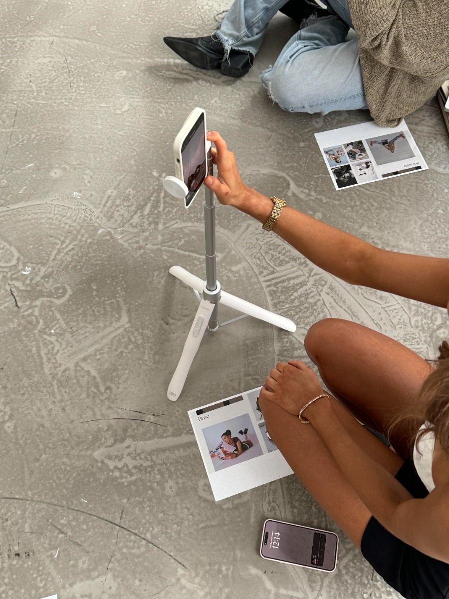 Creator filming vertical video content on a phone rig for a client campaign